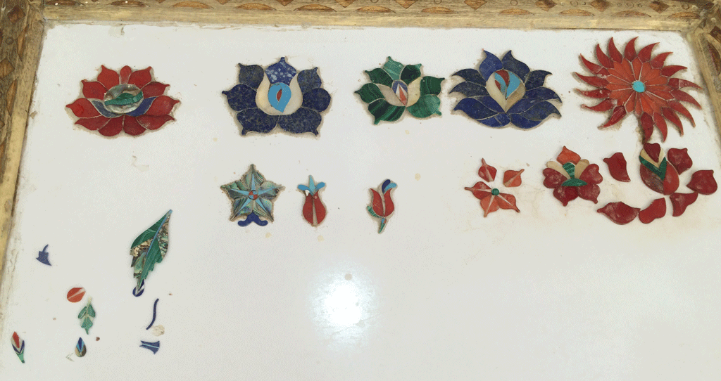 The tiny inlay pieces of semi-precious stones