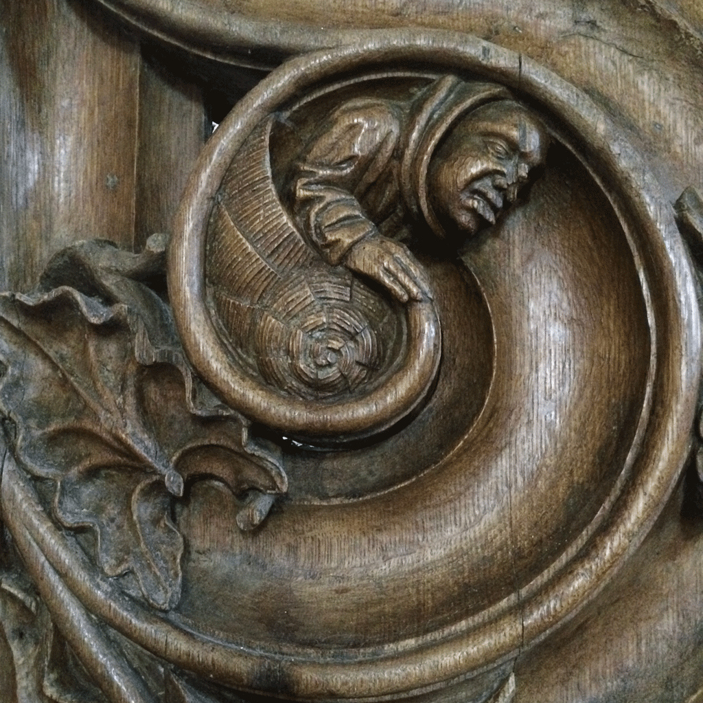 One of the scuptures on the stalls in Saint Hilaire
