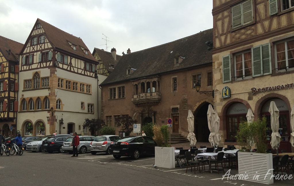 Far left, Maison Adolph, probably the oldest house in Colmar built in about 1350, with gothic pointed arch windows. Left, le corps de garde,, built in 1575. The loggia was used by the magistrate to hand down sentences.
