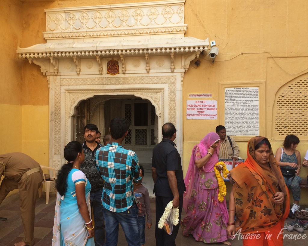 Removing our shoes in front of the temple