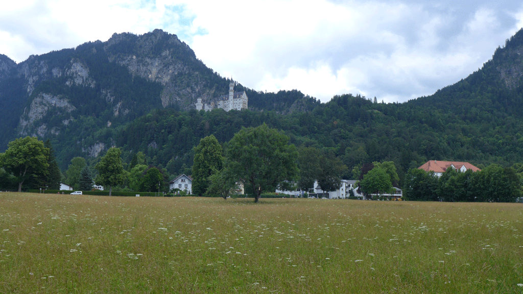 Neuschwanstein castle barely visible in the background