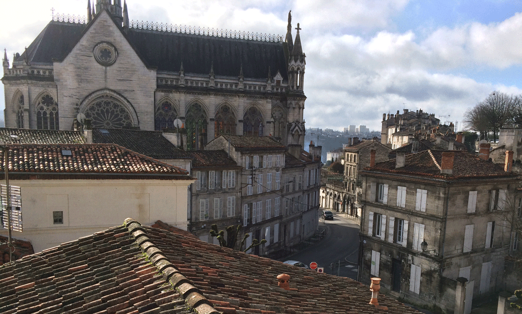 Roman-tiled rooftops and the rcently built church of Sainte Aubézine