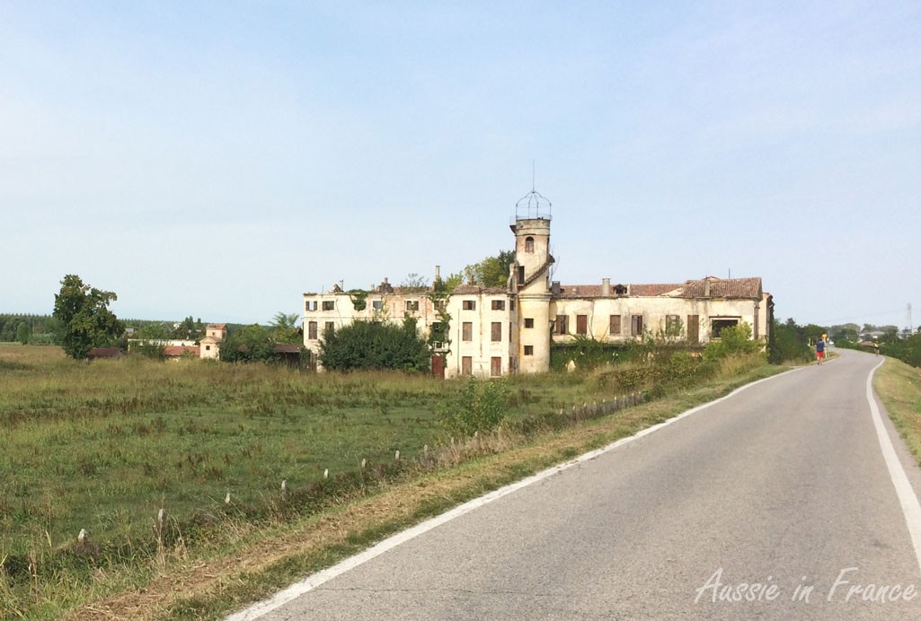 A delapidated building on the bike path