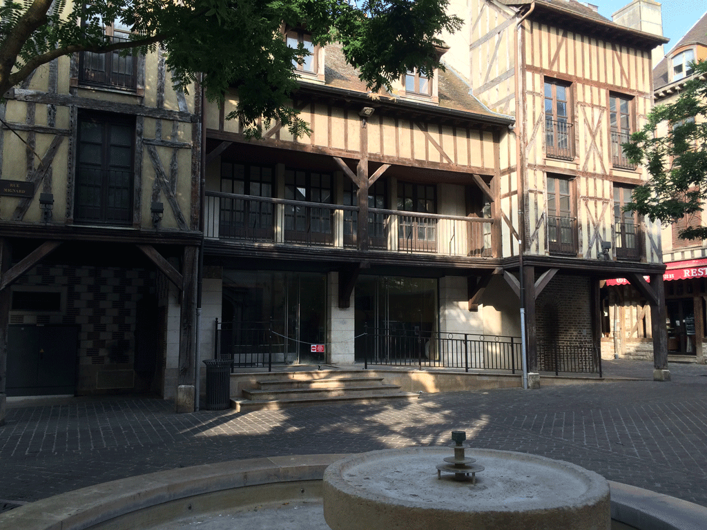 Half-timbered houses on the other side of the square from Saint John's