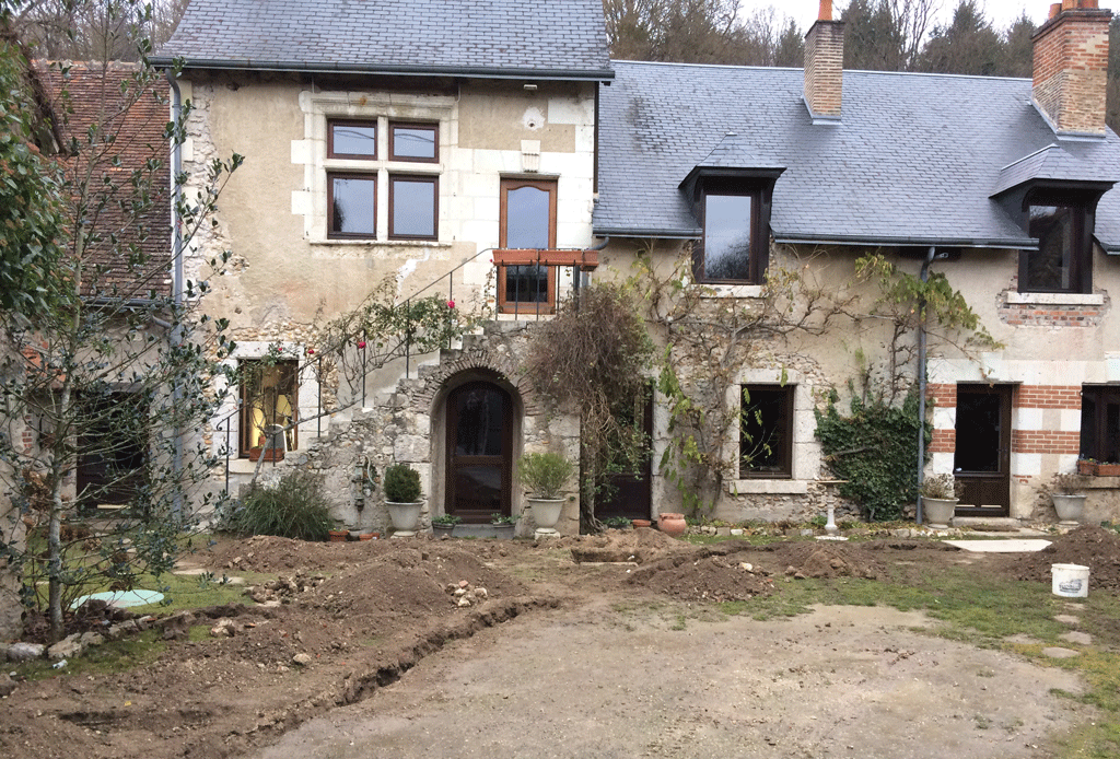 The current state of the garden while the watering installation is in progress.