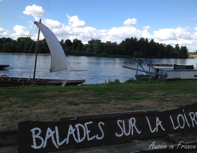 A gabarre flat-bottomed boat ready to take tourists on the Loire at Château de Chaumont
