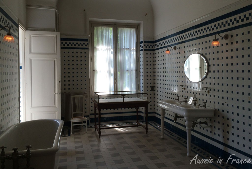 One of the bathrooms. The left door leads to the toilet which has an opaque window overlooking the park.