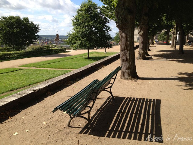 A bench casting shadows in Jardin de l'Evêché in Blois