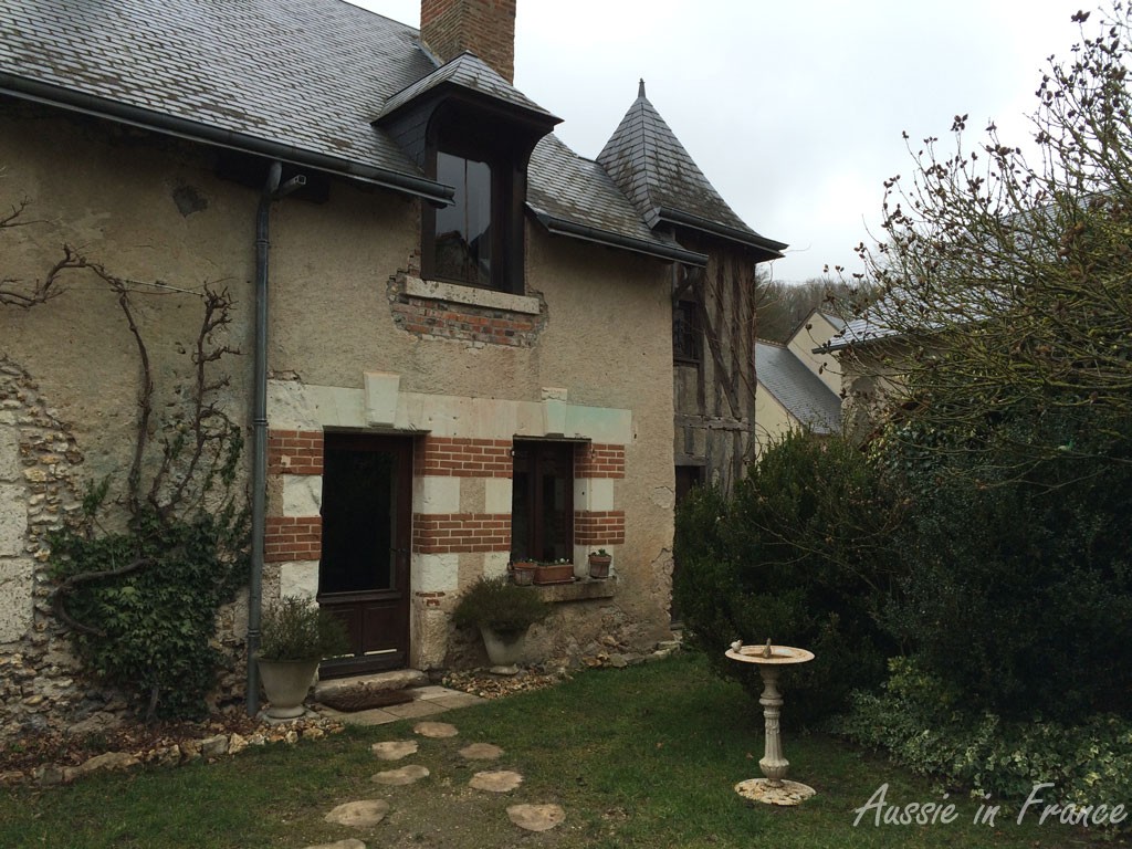 The brick and stone façade of our house at the kitchen end