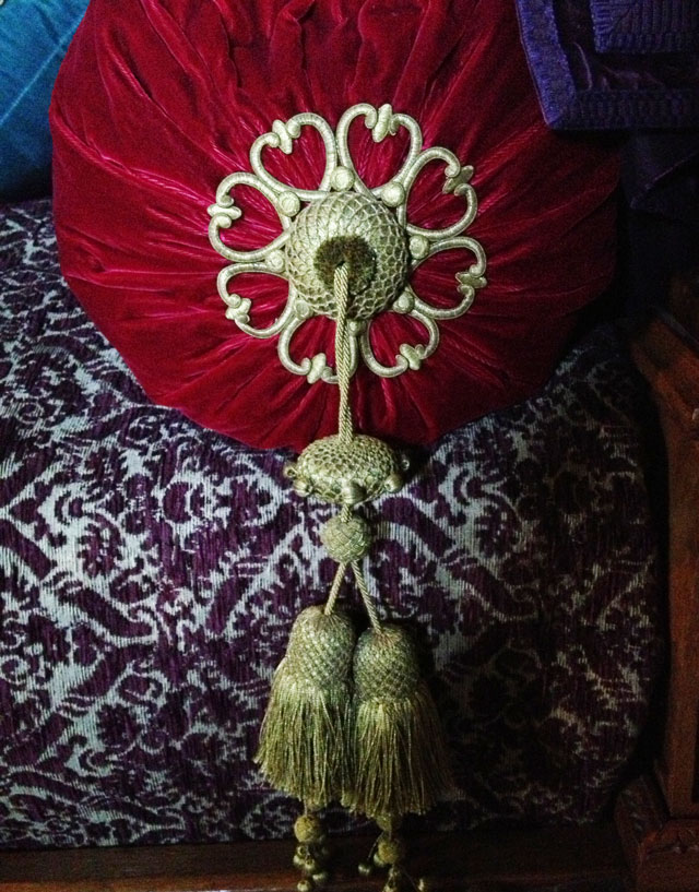 Cartisane on red velvet bolster