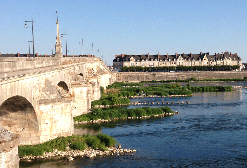 You can see the remains of the wooden piers of the temporary bridge near the middle stone arch