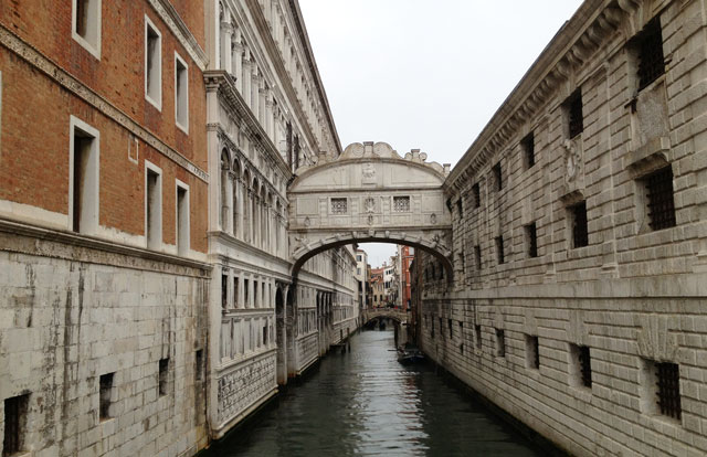 The famous Bridge of Sighs, with an unusually empty canal beneath due to the rain