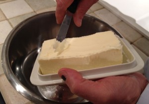 Putting curls of butter into the flour