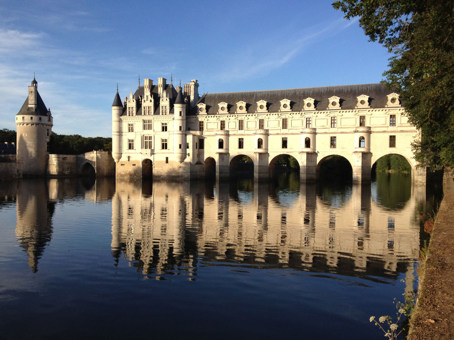 Chenonceau reflected in the Cher at dusk