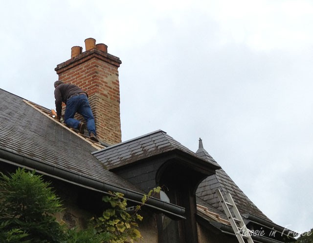 Mr B. climbing up the roof with his spray cans