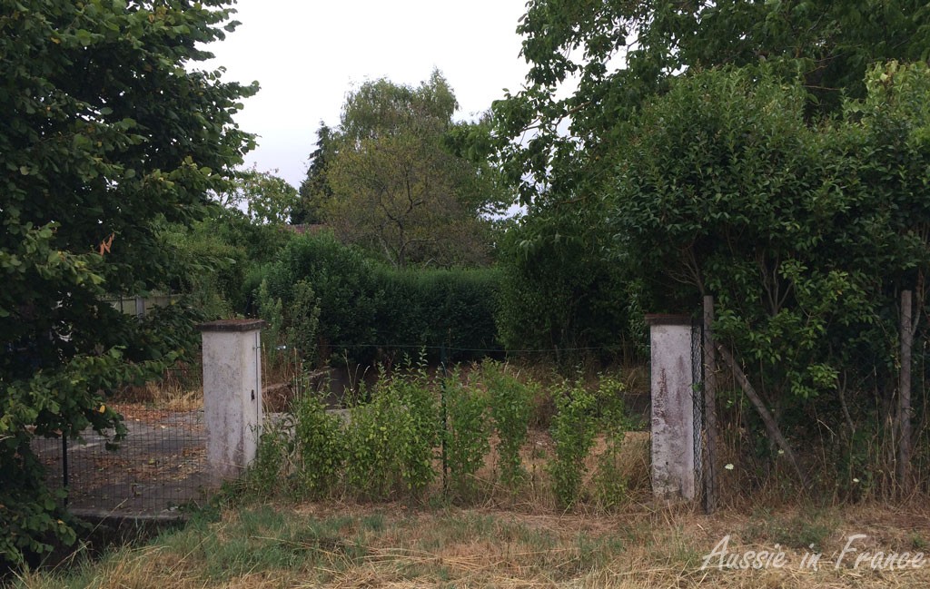 The very closed gate at the end of the path