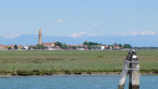 The marshland between Treporti and Erasmo Chiesa with Burano and the snow-capped peaks of the Dolomites in the distance