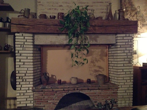 Our boarded-up downstairs fireplace