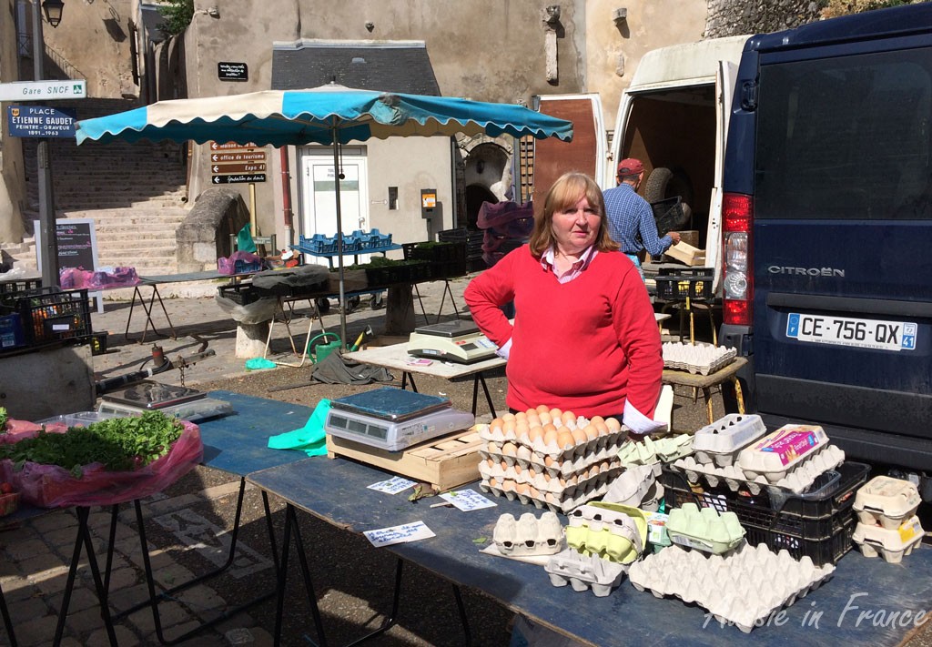 The egg lady who is part of the fruit & vegetable stall
