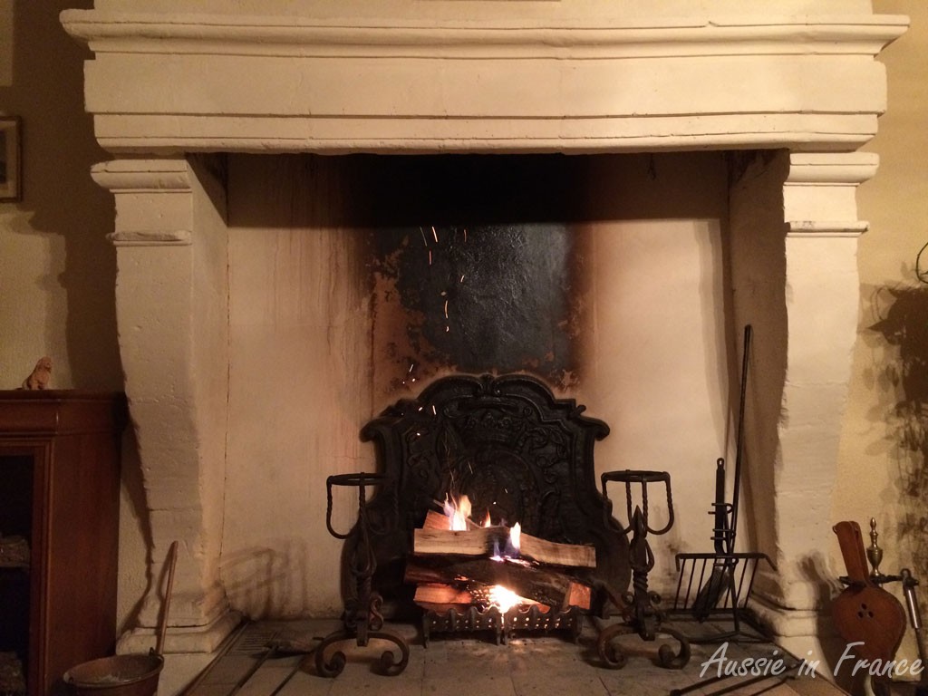 The fireplace with the andirons we bought at the brocante