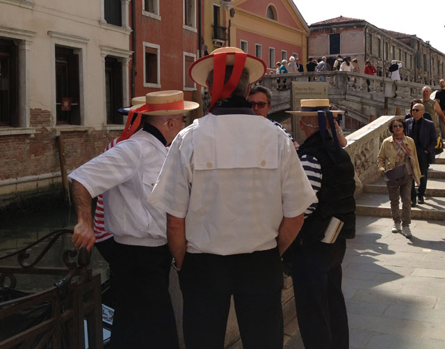 Gondoliers in their traditional garb