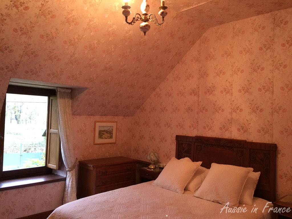 The peeling paper in the guest bedroom with its very high ceiling