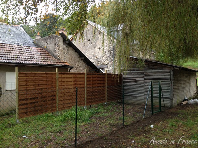 The enclosure, with the lean-to on the right which is up against our barn and the house that is going to be pulled down to form a garden for the gîte