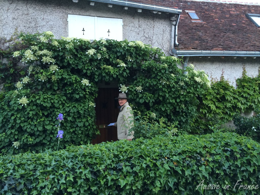 Jean Michel putting a flyer in one of the letterboxes
