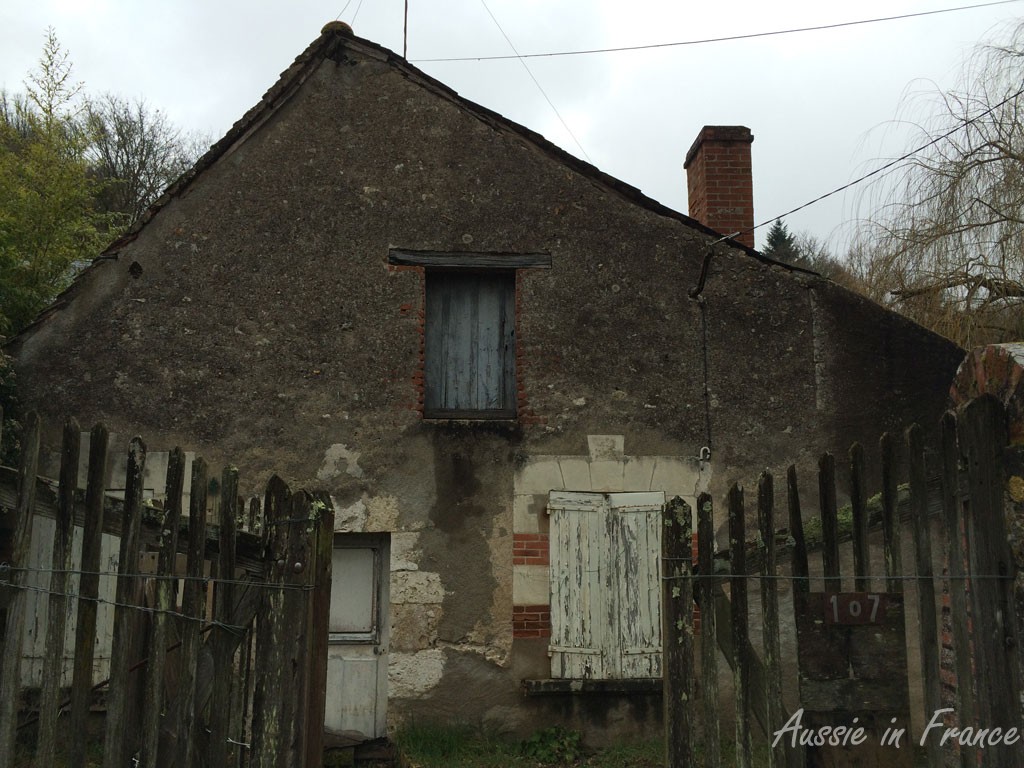 The façade of the little house at the moment, which is rather ugly, you will agree!