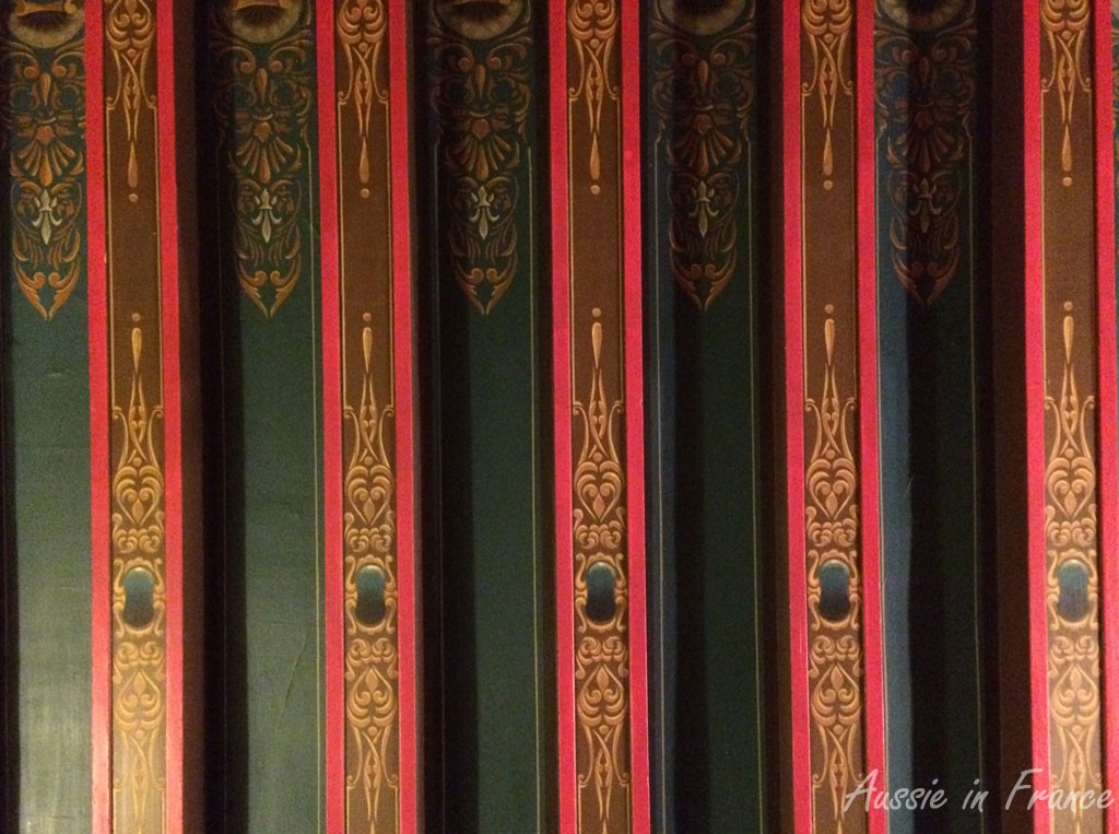 A close-up of the painted ceiling which is actually papered.