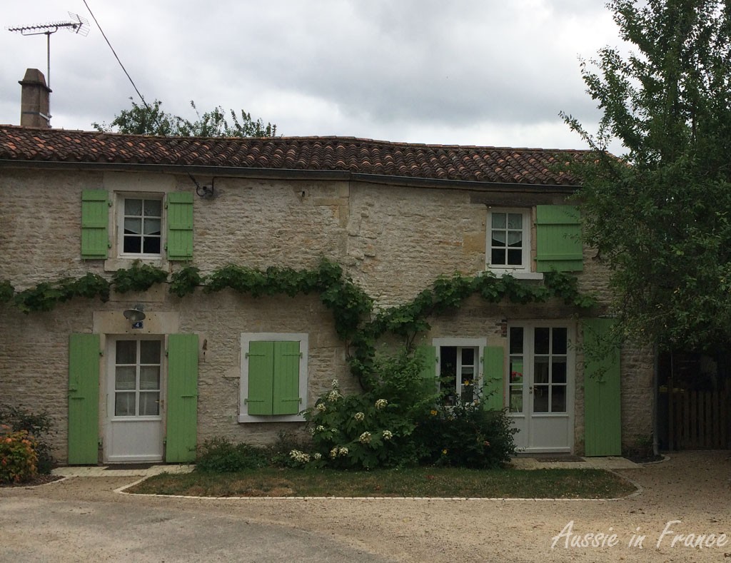 Typical stone house with painted shutters