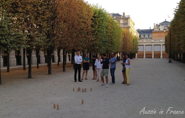 People in the Palais Royal Gardens playing an unknown game