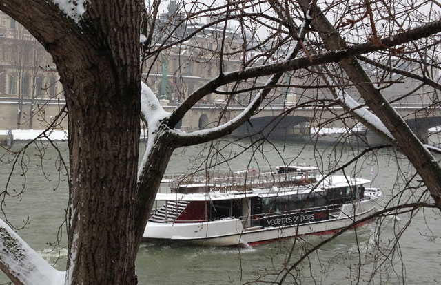 River boat carrying tourists on the Seine