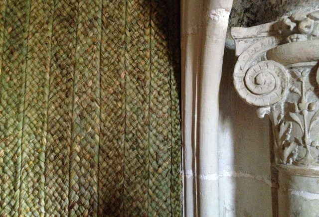 Rush matting next to monumental fireplace