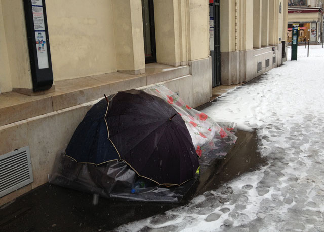 Bag lady in her cold tent
