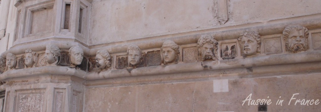 Some of the sculpted heads on Saint James' cathedral