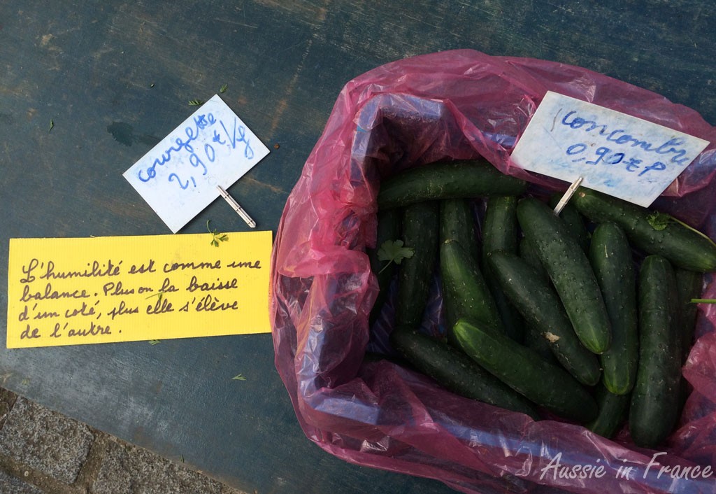 one of the philosophical signs on the fruit & vegetable stall