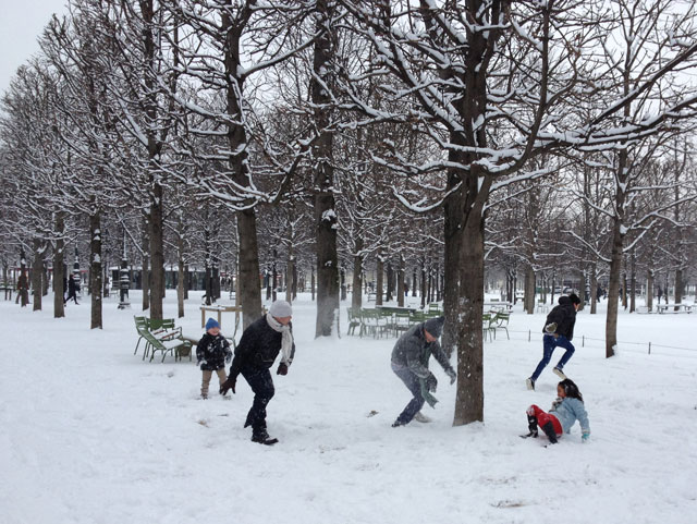 Family having a snow fight in the Tuileries Gardens