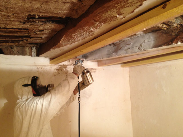 Spraying with limewash after putting up the beams