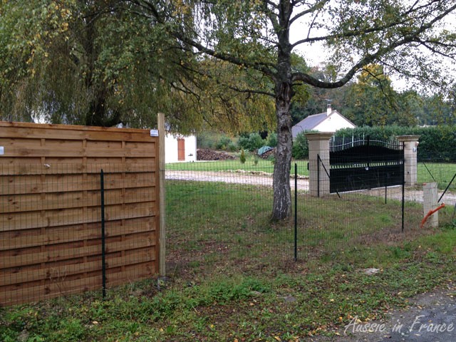 The first two panels erected between our wall and the neighbour's gate