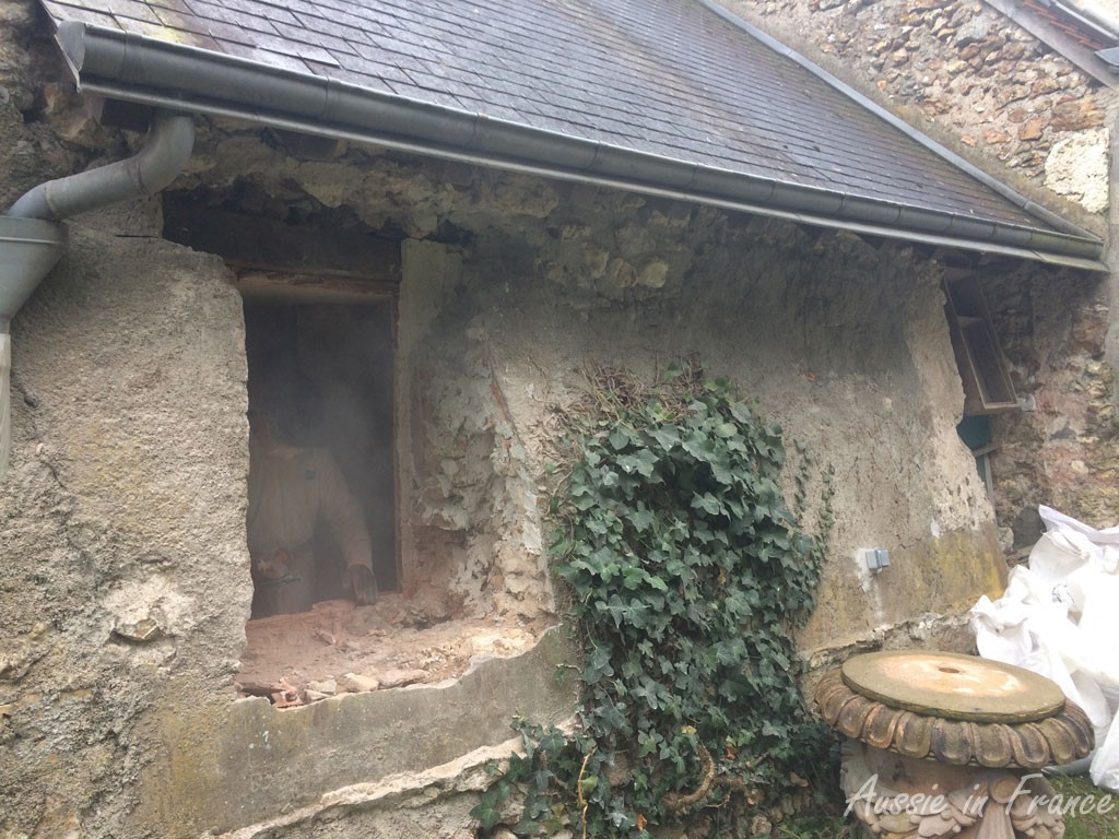 Jean Michel cutting through the lining bricks  from the inside